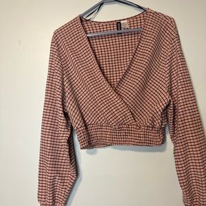 Long sleeve crop top. Mock wrap. Size medium. Pink with black and gray strips